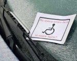 Безосновательная парковка на местах для инвалидов подорожает. водитель, законопроект, инвалид, инвалидность, парковка, handwriting. A close up of a piece of paper
