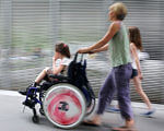 В області впроваджується системний підхід до підтримки дітей з інвалідністю. запорізька область, дитина-інвалід, раннє втручання, тренинг, інвалідність, person, road, window, wheel, riding, clothing, tire, auto part, toddler. A woman riding a bike next to a window