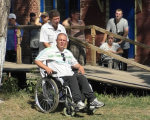 У Чернігові відкрився комплексний центр для людей з інвалідністю (ВІДЕО). го інтеграція, чернігів, комплексний центр, інвалід, інвалідність, person, grass, outdoor, clothing, man, wheelchair, smile, footwear. A group of people sitting on a bench