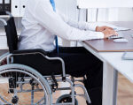 Українські роботодавці розповіли, чому в них працює так мало людей з інвалідністю. опитування, працевлаштування, роботодавець, інвалідність, інклюзія, person, indoor, wheelchair, furniture. A person sitting in a chair