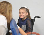 Затвердили список дитячих захворювань, що дають право на отримання держдопомоги. держдопомога, захворювання, перелік, список, інвалідність, person, wall, human face, indoor, clothing, smile, girl. A young girl sitting on a chair