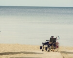 Пляжи Одессы станут комфортными для людей с ограниченными возможностями. одесса, отдых, пандус, пляж, пресс-конференция, water, outdoor, beach, sky, bicycle, people, wheel, sand, bike, vehicle. A group of people riding on top of a sandy beach